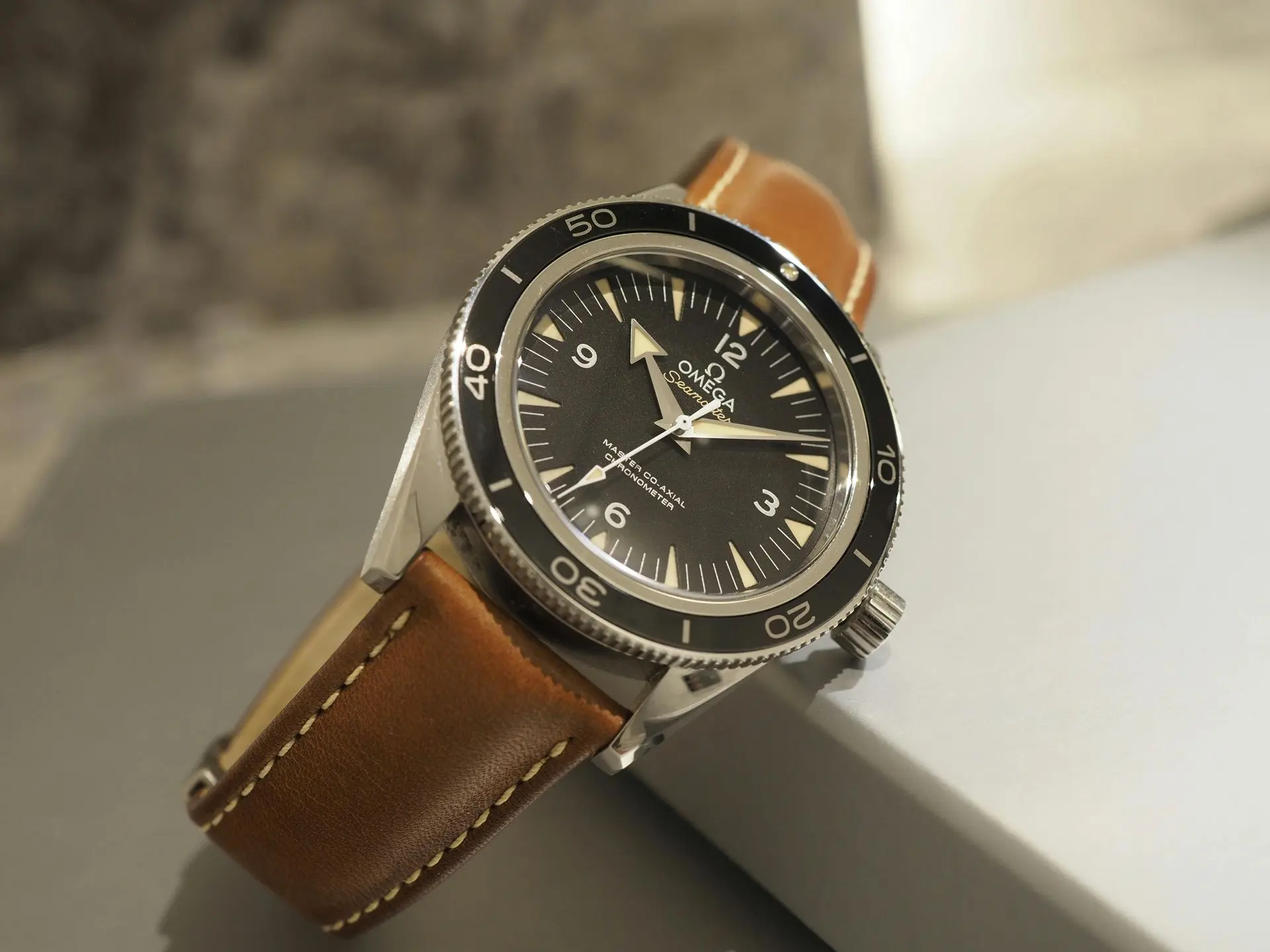 "Close-up of a simple time-only watch on a brown leather strap, highlighting practicality and everyday reliability