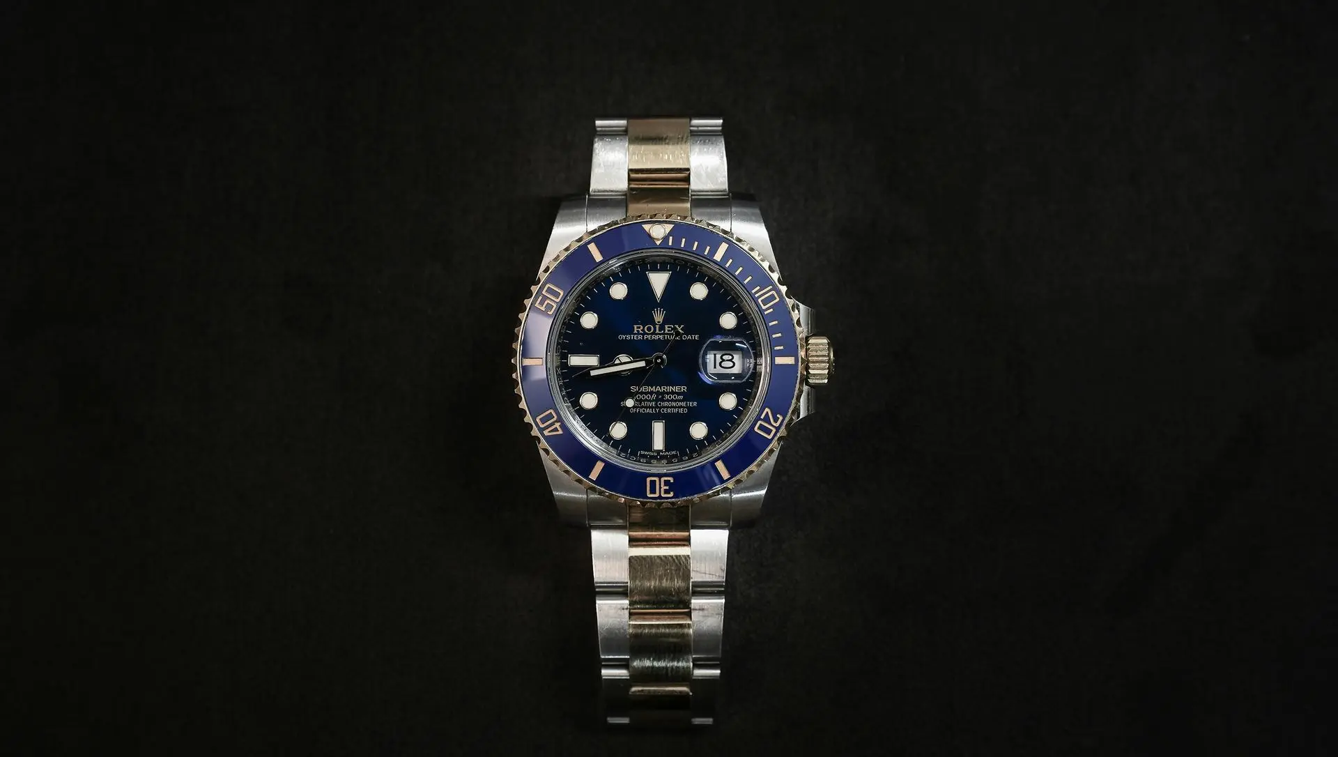 Automatic Watch Investment Rolex Luxury steel and gold dive watch displayed on a dark background, showing how Rolex automatic watches are highly valued for long-term investment potential.