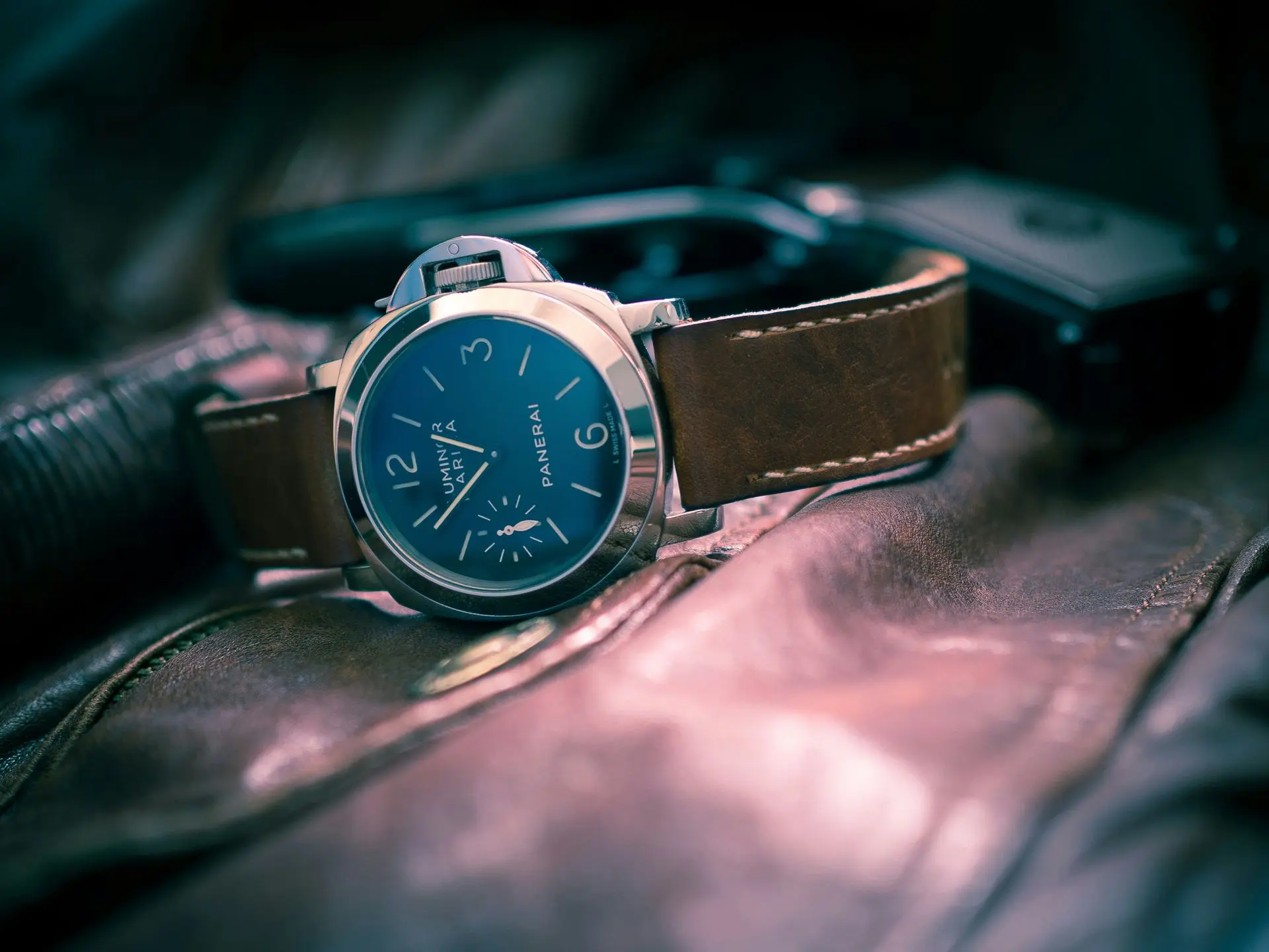 Italian international automatic watch brand displayed with a Panerai timepiece on a leather strap