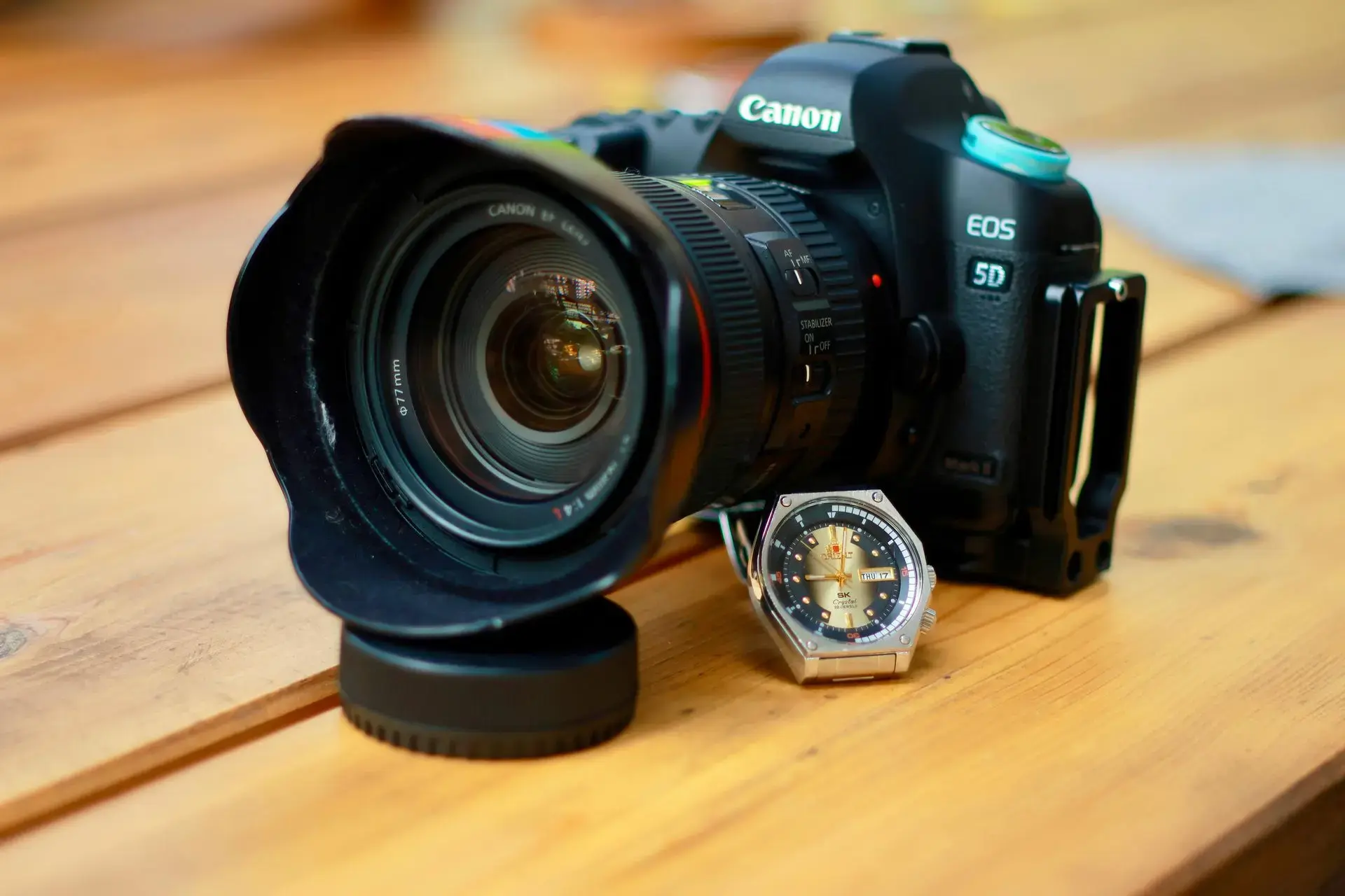 DSLR camera setup with wristwatch for professional watch photography.