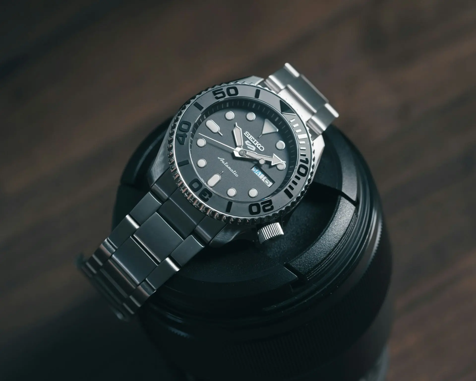 Automatic stainless steel dive watch with mechanical movement, symbolizing timeless design, craftsmanship, and heritage