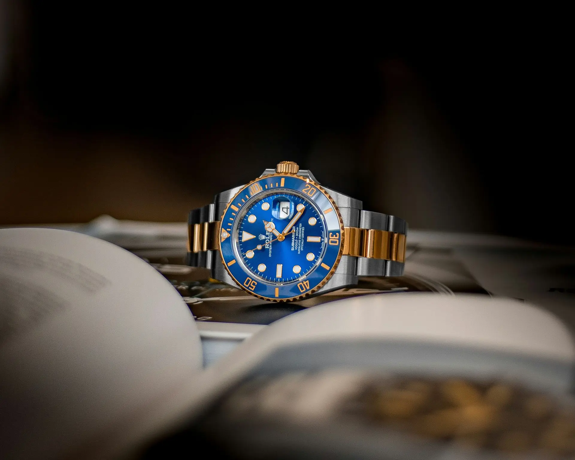 Rolex Submariner automatic dive watch with blue dial and two-tone stainless steel bracelet, iconic luxury sports watch