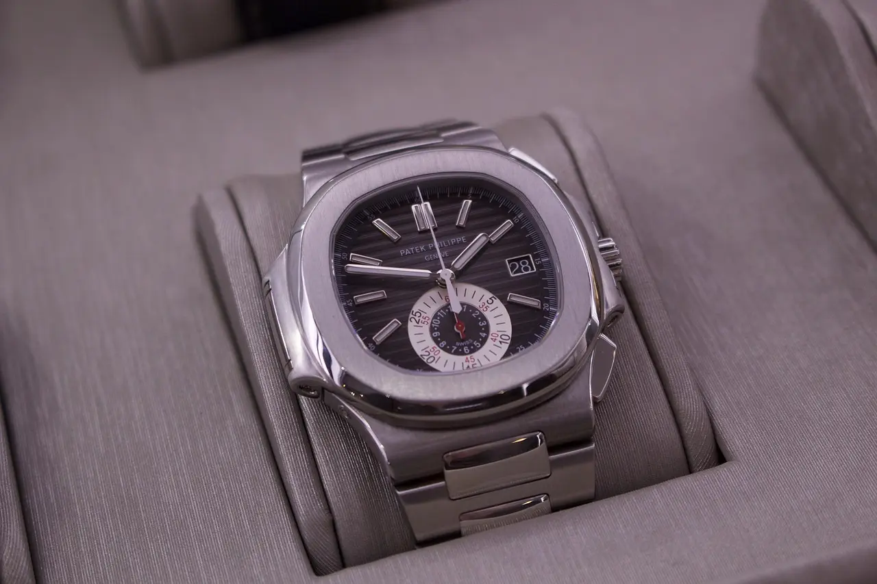 Patek Philippe Nautilus automatic luxury sports watch with stainless steel case, integrated bracelet, and iconic dial