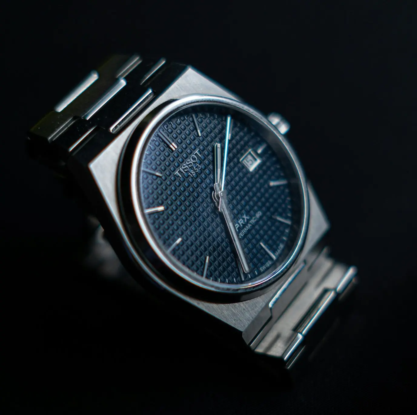 Tissot PRX Powermatic 80 automatic watch with textured blue dial and integrated stainless steel bracelet