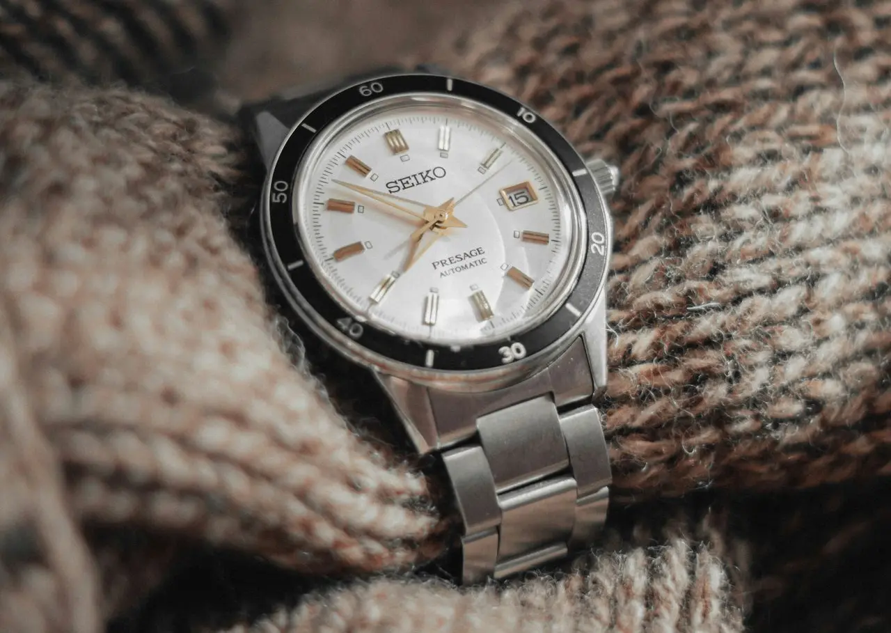 Seiko Presage Automatic Watch with White Dial and Date Window Seiko Presage automatic watch with white dial, gold markers, and stainless steel bracelet