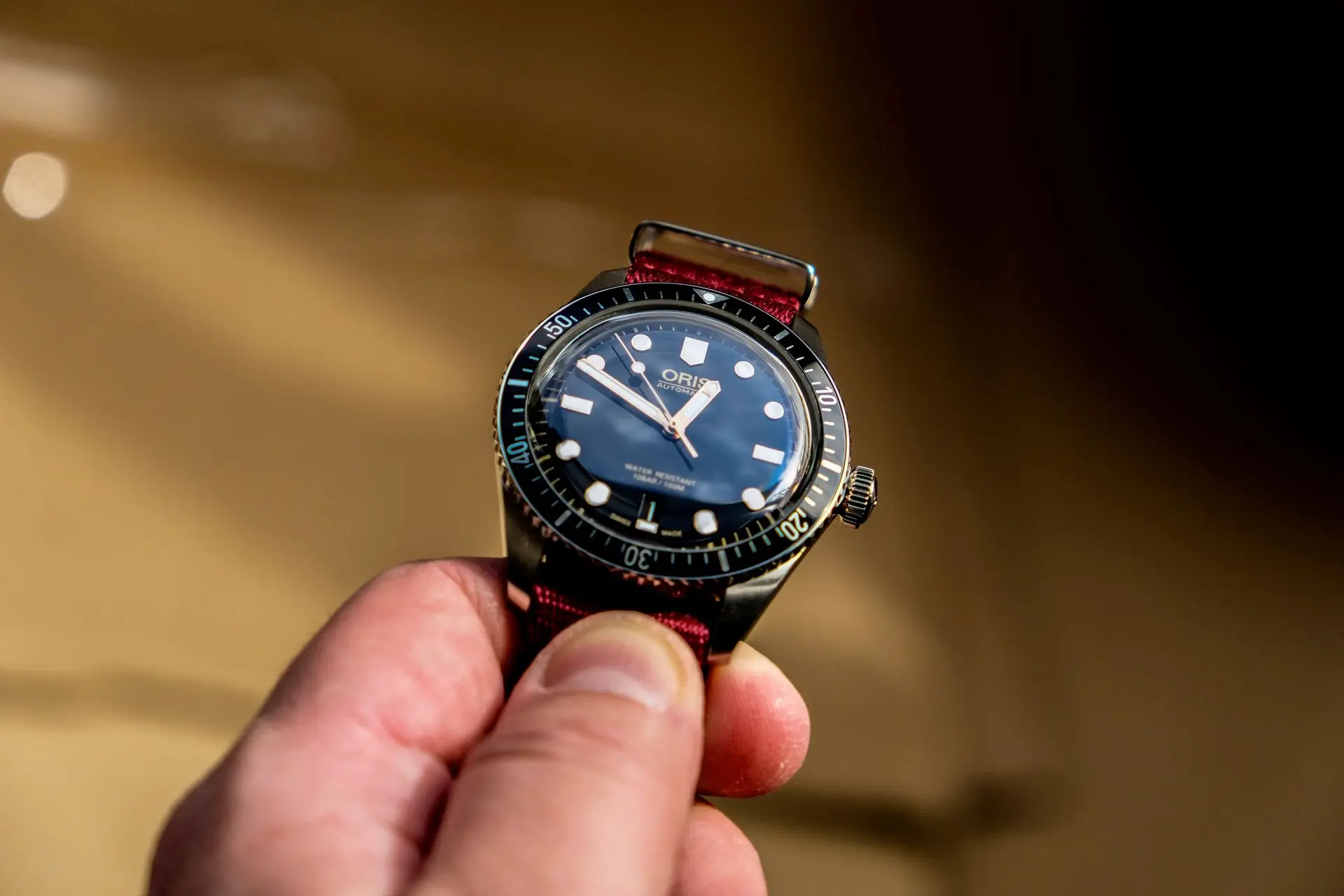 Oris Divers Sixty-Five Vintage Style Automatic Dive Watch Oris Divers Sixty-Five automatic dive watch with blue dial and red strap