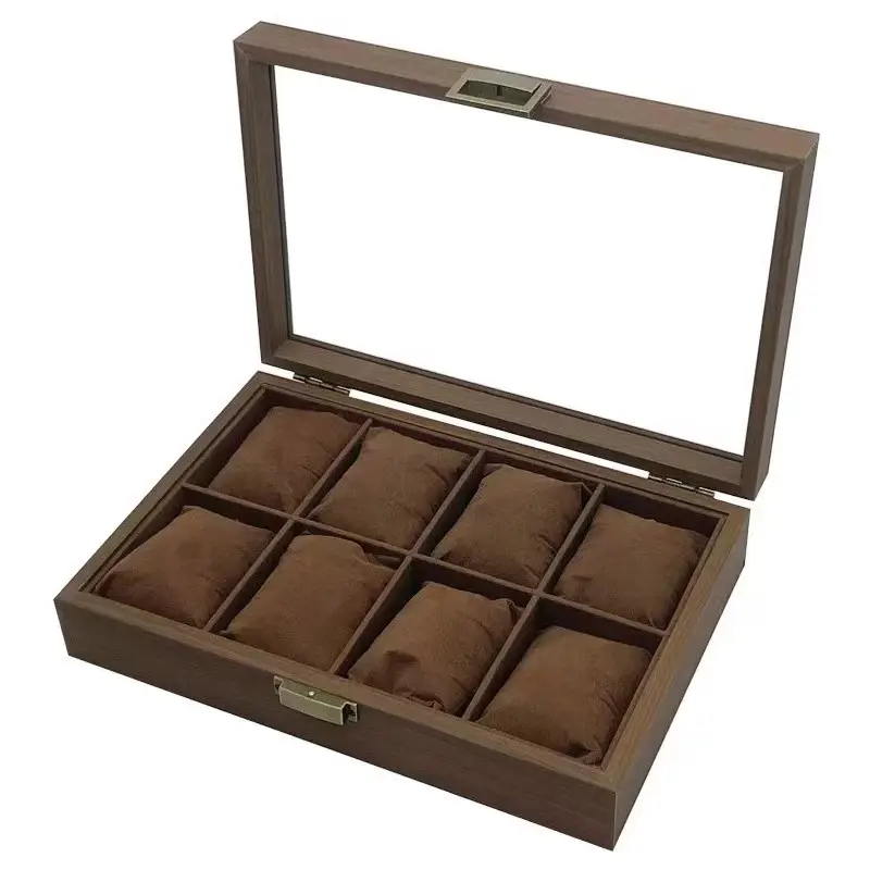 Wooden watch display case with glass lid and cushioned compartments for organizing luxury watches