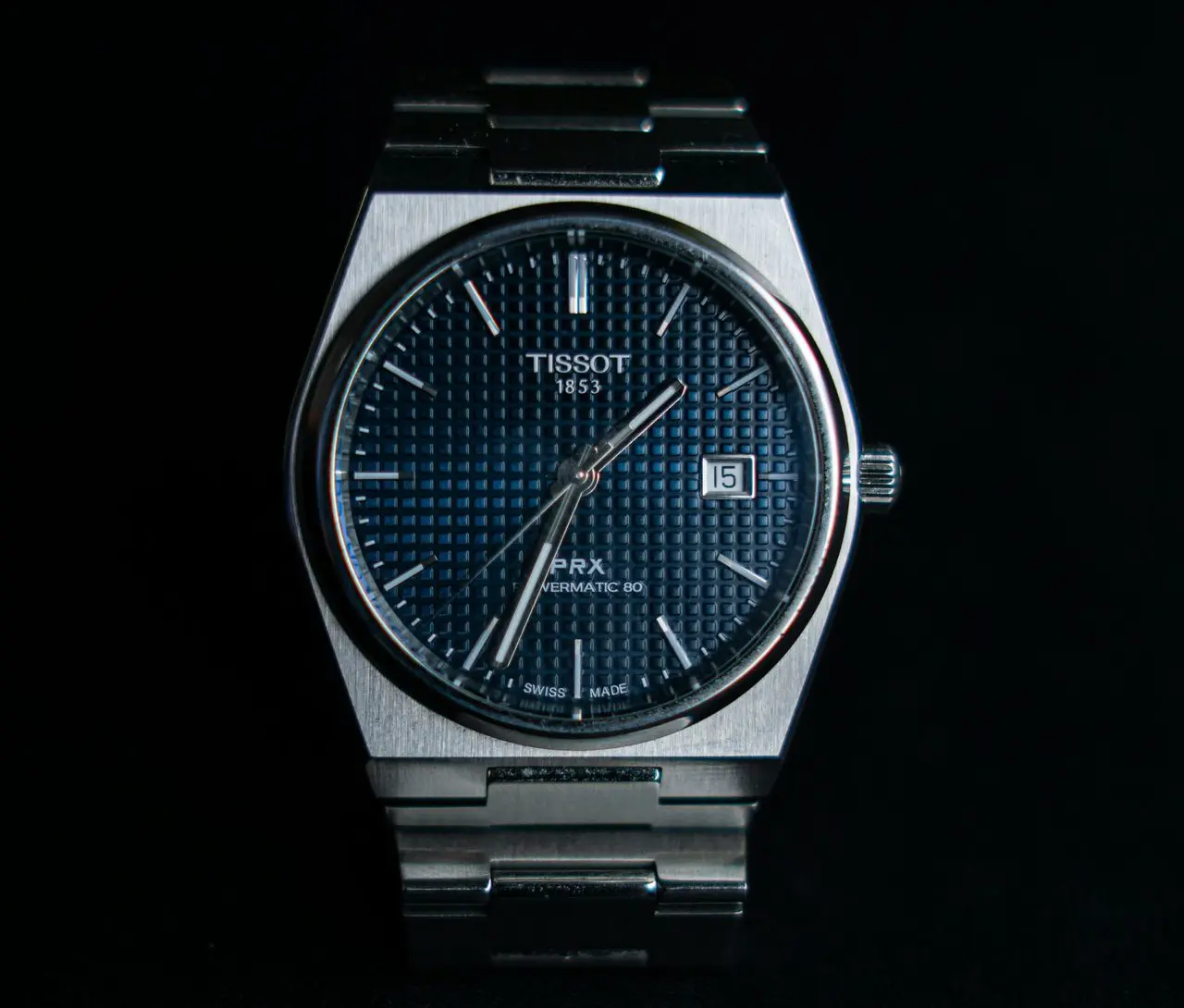 Tissot PRX Powermatic 80 automatic watch with blue textured dial and stainless steel bracelet