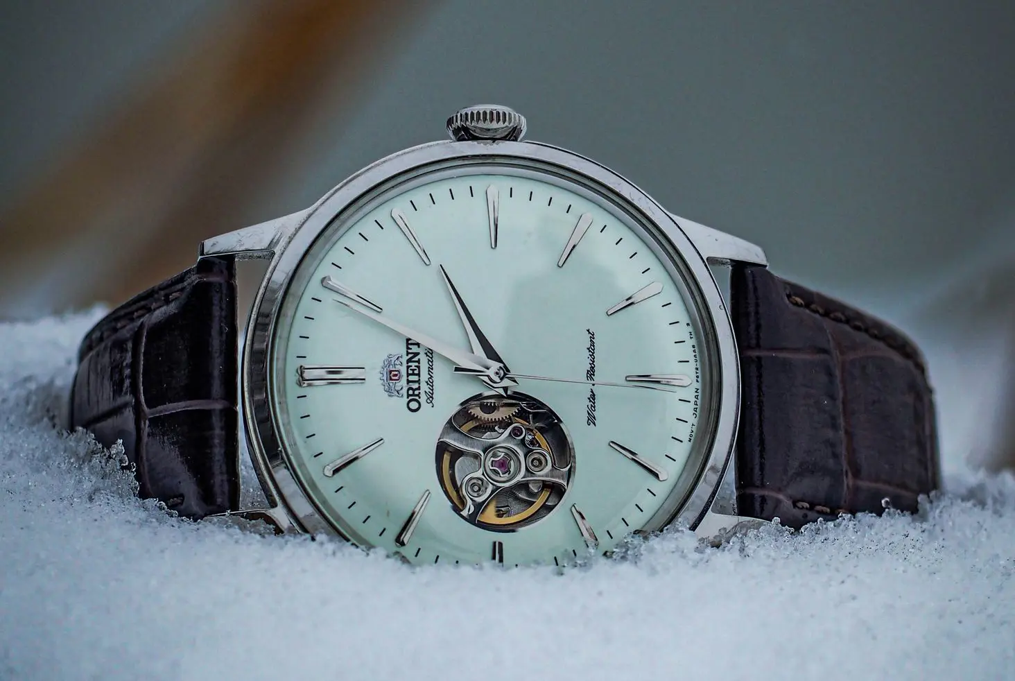 Orient Bambino Open Heart Automatic Watch Orient Bambino Open Heart automatic watch with white dial and leather strap on snow