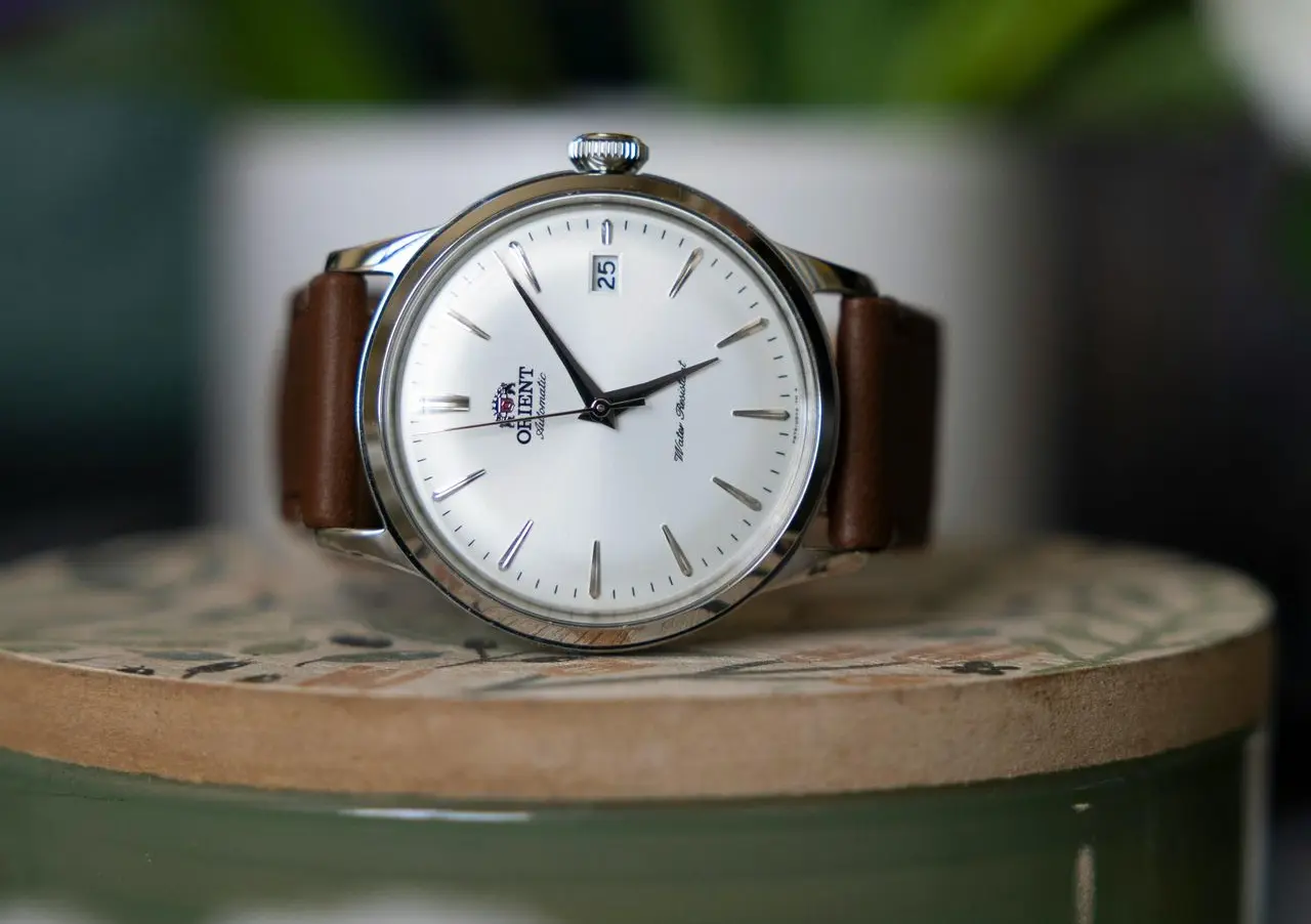 Orient Bambino Automatic Dress Watch Orient Bambino automatic dress watch with white dial and brown leather strap on display