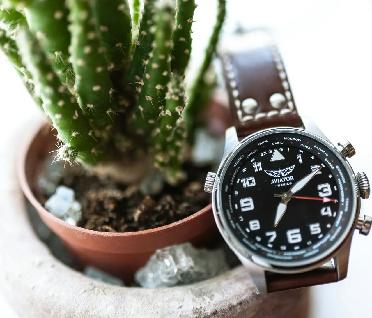 Aviator pilot GMT watch with world time bezel and leather strap