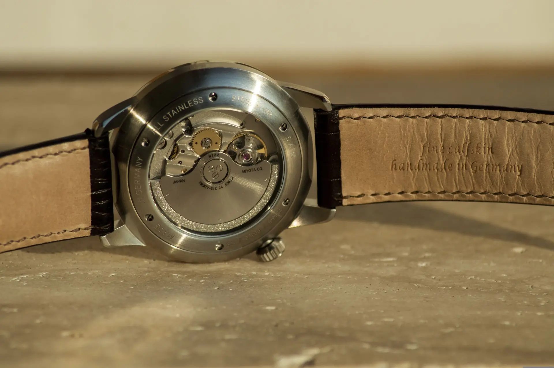 Automatic watch movement with Miyota rotor visible through exhibition caseback