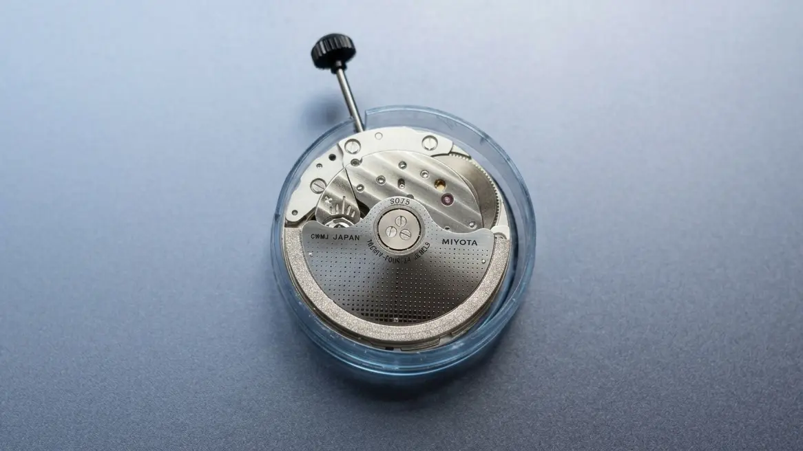 A Miyota 9075 movement on a table without case or other components.