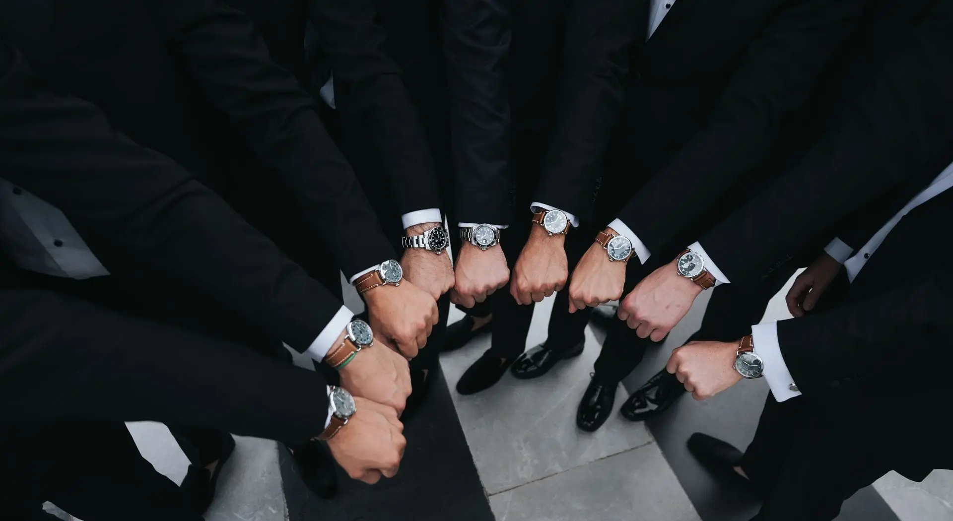 Dress Watches Paired with Formal Outfits and Accessories People wearing dress watches with formal suits, demonstrating how to match timepieces with formal attire and accessories