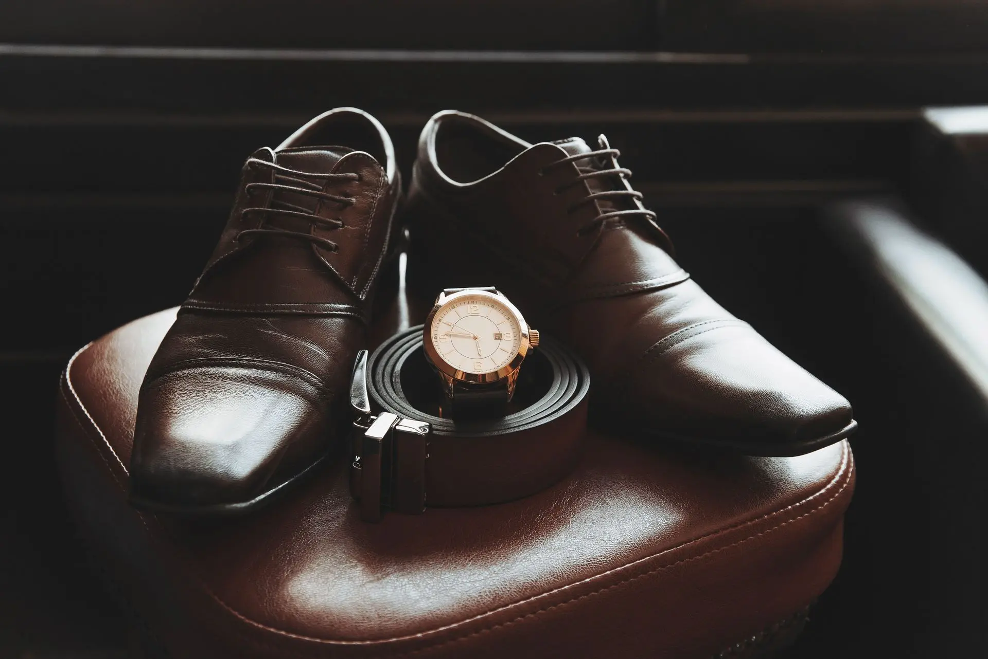 Matching Dress Watch with Shoes and Belt for a Coordinated Look Dress watch paired with brown leather shoes and belt to demonstrate coordinated accessories for business and formal style