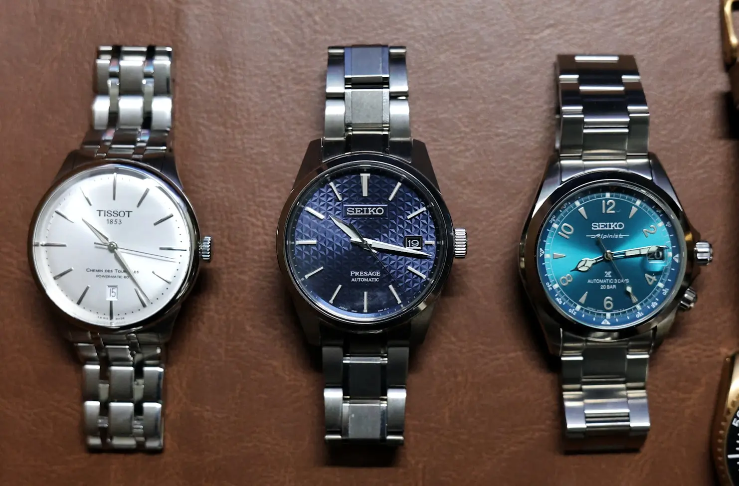 Minimalist watch collection featuring an everyday watch, dress watch, and sports watch
