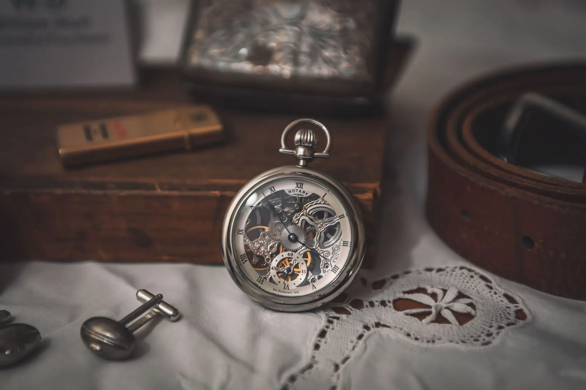 Vintage skeleton pocket watch illustrating traditional craftsmanship, engraved metalwork, and intricate mechanical movement