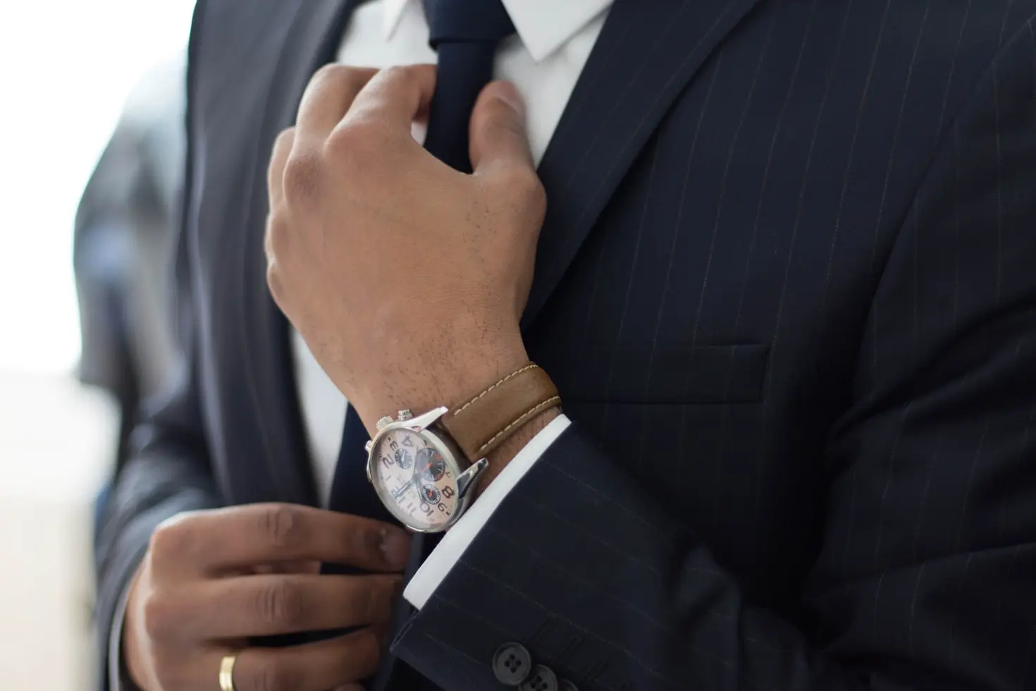 Business professional wearing a stylish wristwatch, showing the versatility of wristwatches in modern fashion and everyday wear