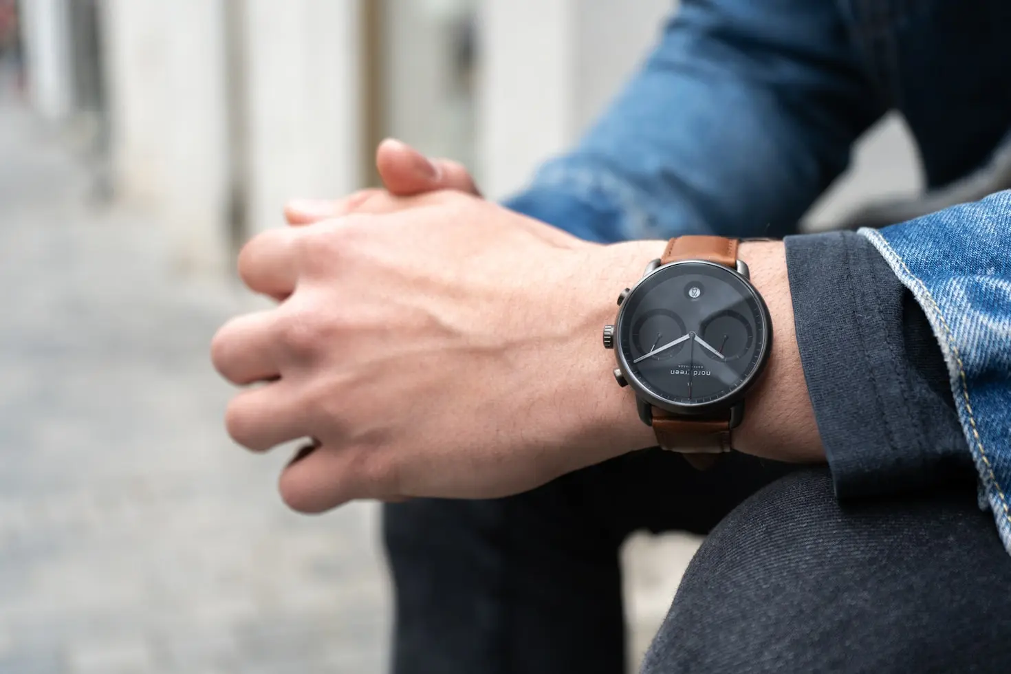Minimalist wristwatch with leather strap showing why wristwatches are easier to carry than pocket watches