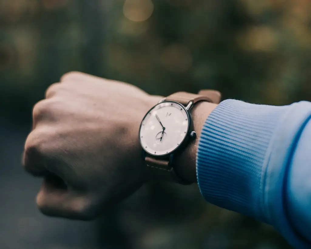 Modern analog wristwatch showing why wristwatches are faster to read than pocket watches during everyday activities