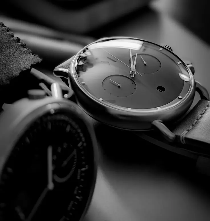 Watch logos and luxury watch dials showcasing different brand identities