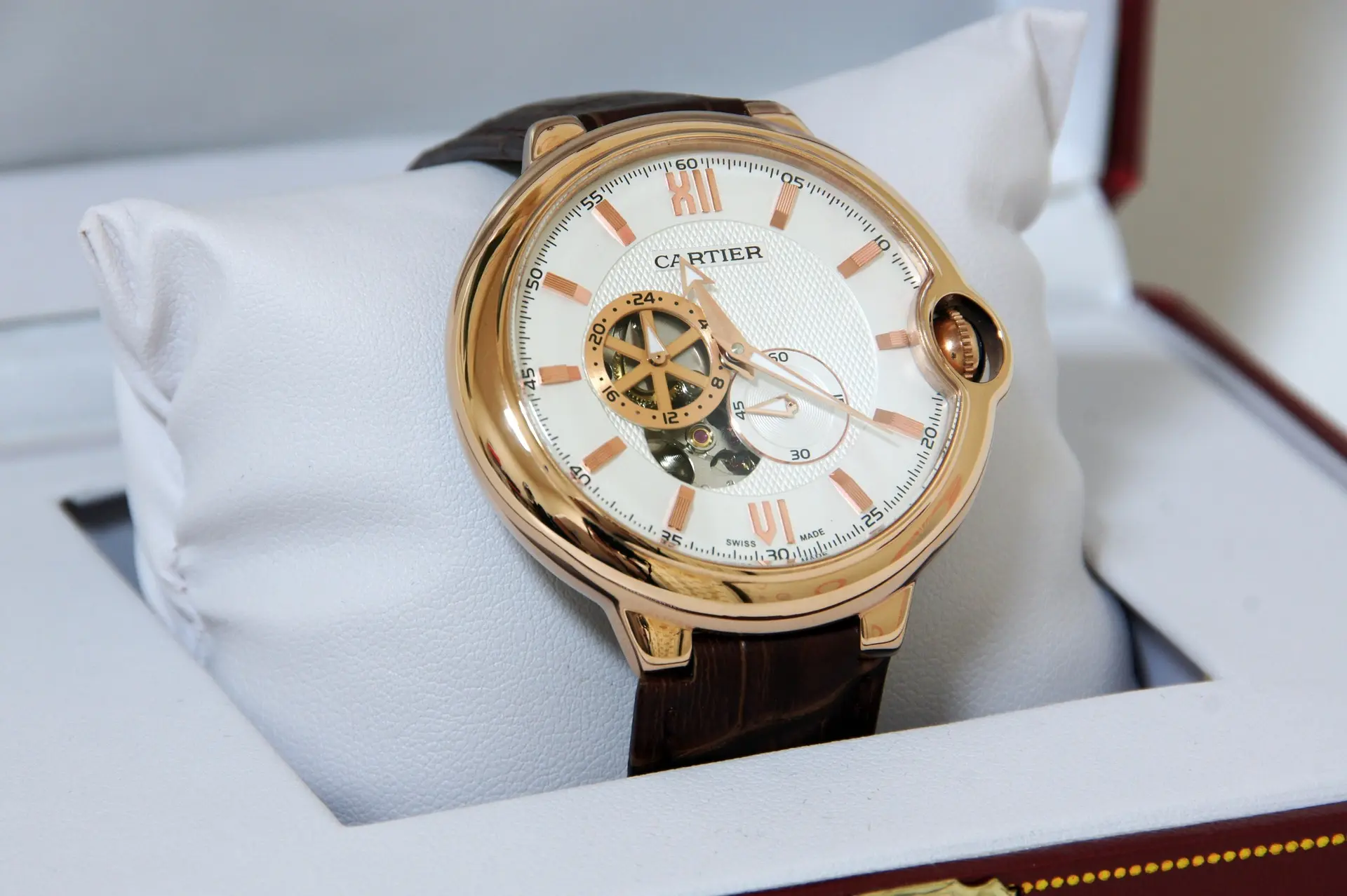 Cartier Wordmark Logo on Luxury Watch Dial Cartier watch with iconic wordmark on luxury dial