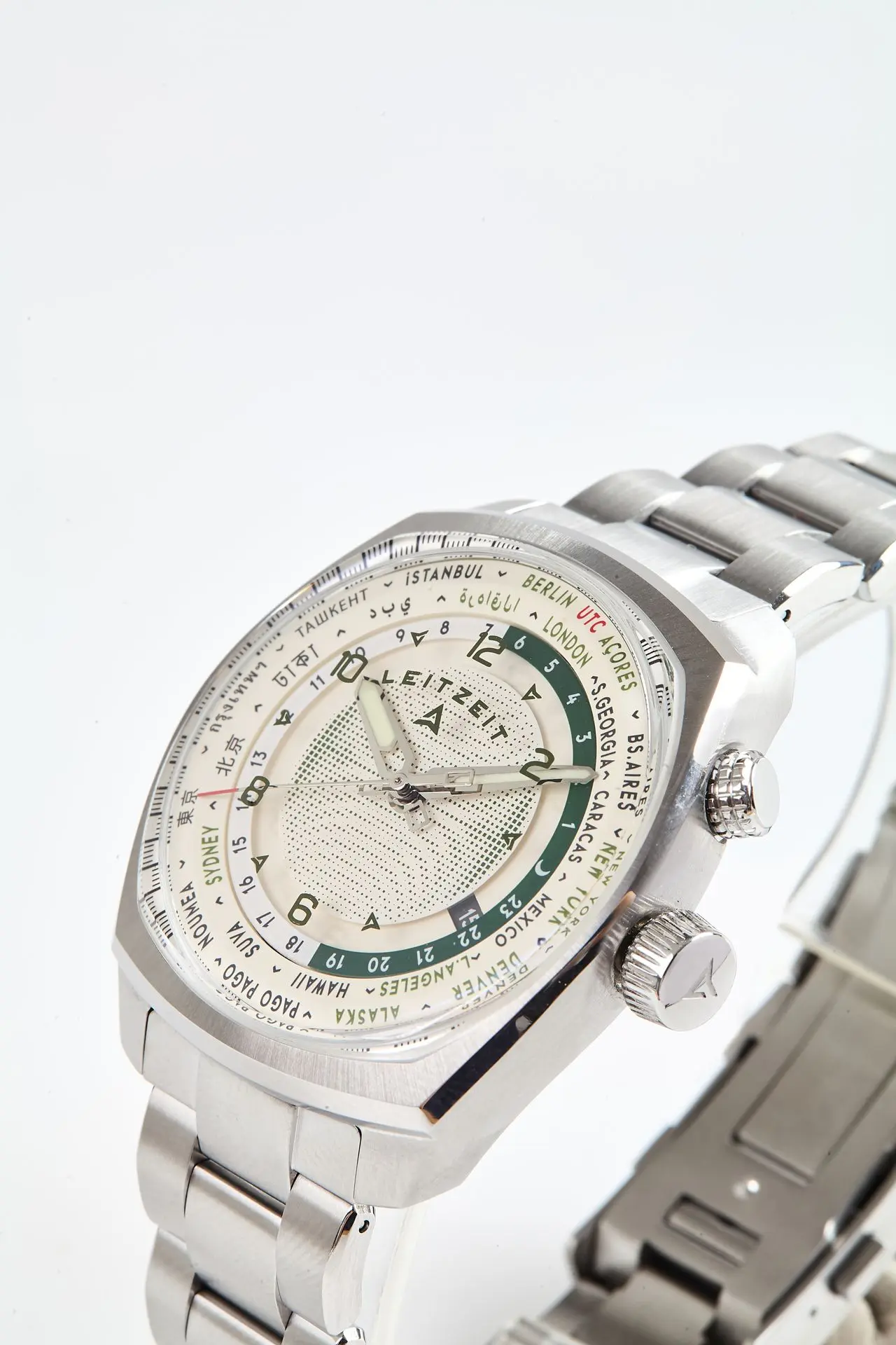 Close-up of the Axis Mundi Worldtimer with light dial, dual crowns and stainless steel bracelet