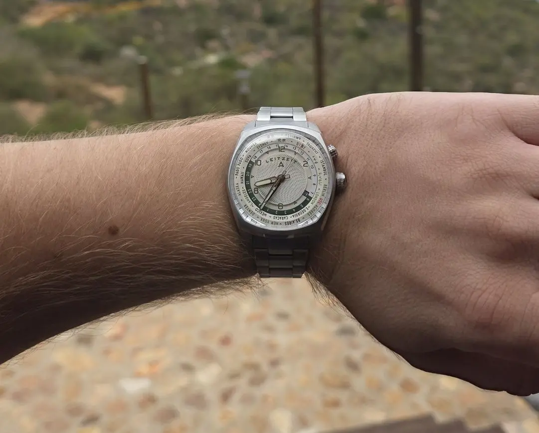 Axis Mundi world time watch worn on wrist outdoors
