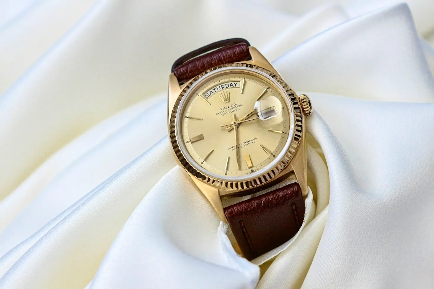 Gold Rolex Day-Date with fluted bezel and champagne dial