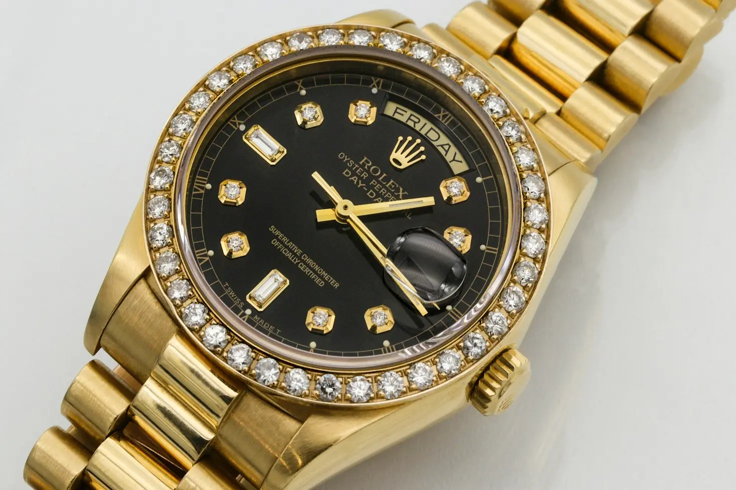 Gold Rolex Day-Date with diamond bezel and President bracelet